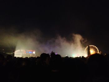 Silhouette of people at night