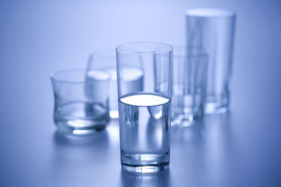 Close-up of drinking glasses on table