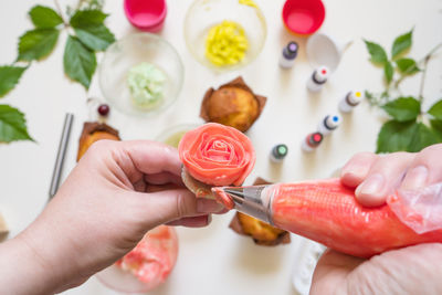 Midsection of woman holding ice cream