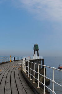 Pier over sea against sky