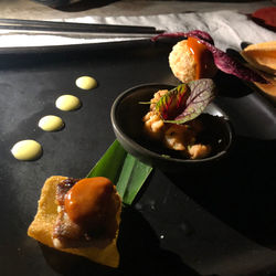 High angle view of fruits in plate on table