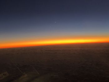 Scenic view of landscape against sky at sunset