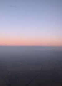 Scenic view of sea against clear sky during sunset