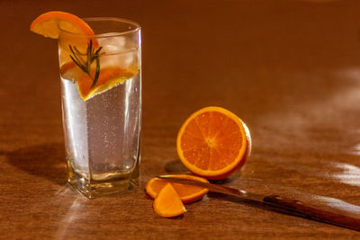 Close-up of orange juice on table