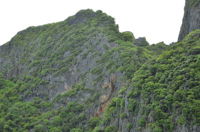 Low angle view of rocks against clear sky