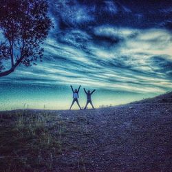 Scenic view of landscape against cloudy sky