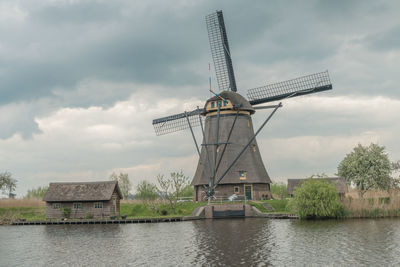 Traditional windmill against sky