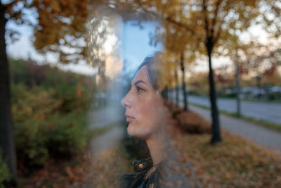 Portrait of young woman looking away