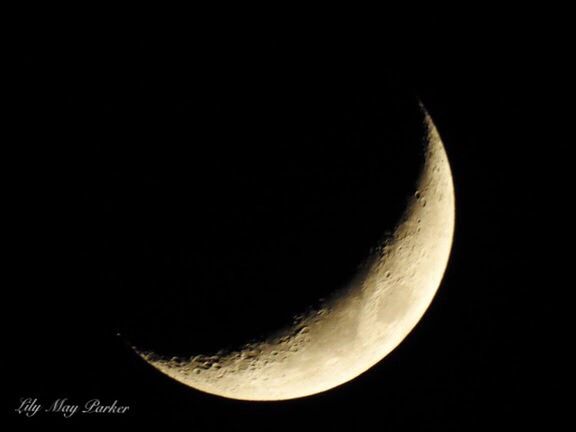 MOON OVER BLACK BACKGROUND