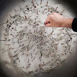 Cropped hand holding incense