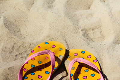 High angle view of shoes on sand