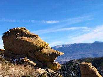 Close-up of rock formations against sky