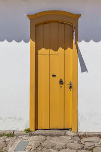 Yellow door of building