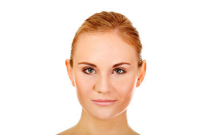 Close-up portrait of a young woman over white background