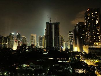 Illuminated buildings in city at night