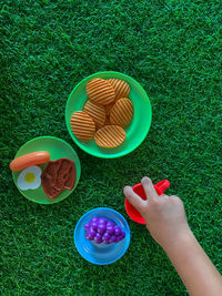 High angle view of hand holding cup
