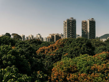 Modern buildings in city against sky