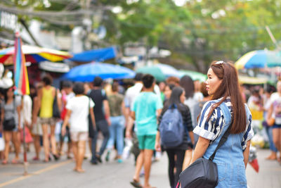 Rear view of woman on street in city