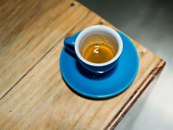 High angle view of coffee cup on table