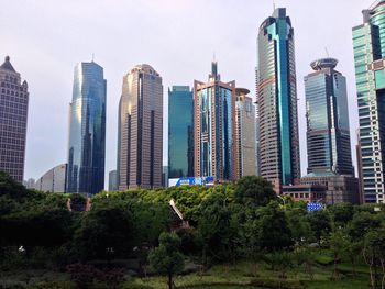 Skyscrapers in city against sky