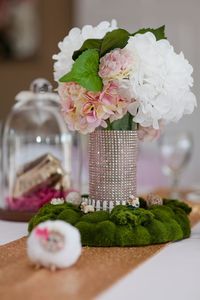 Close-up of roses in vase on table