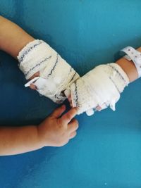 Close-up of hands holding baby