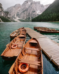 High angle view of boats on lake against mountains