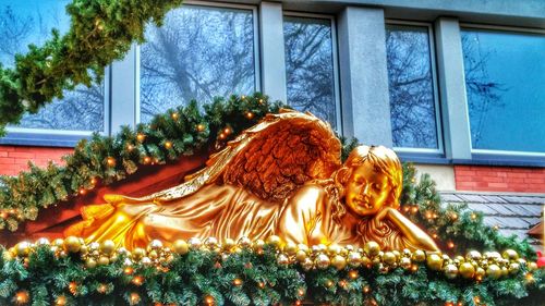 Low angle view of statues on tree