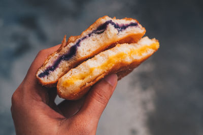 Close-up of hand holding snack