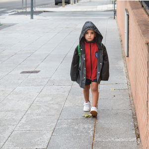 Boy going to school in the street