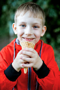 Portrait of smiling boy holding ice cream