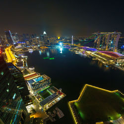 Aerial view of city lit up at night