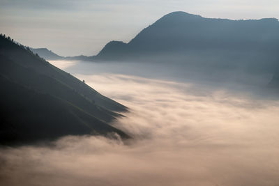 Scenic view of mountains against sky during sunset