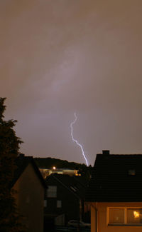 Low angle view of building against sky at night