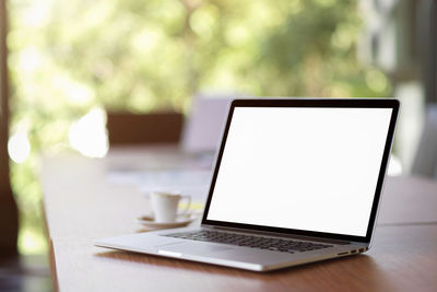 Close-up of laptop on table