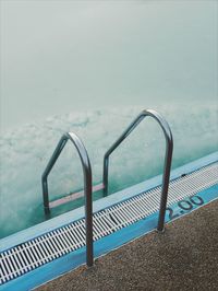 High angle view of swimming pool by sea against sky