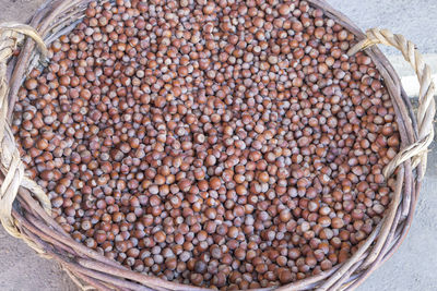 Hazelnuts in a large wicker basket close-up