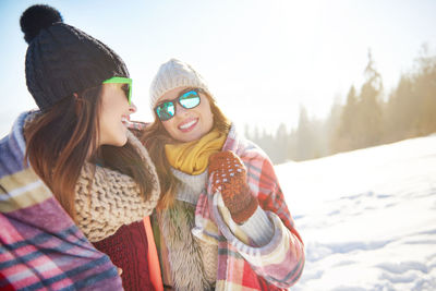Smiling young women in snow