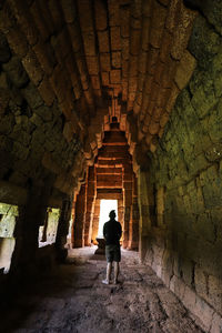 Rear view of man standing in building