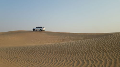 Scenic view of desert against clear sky