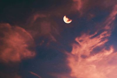 Low angle view of moon against sky at night