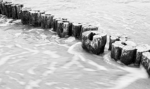 High angle view of groyne in sea