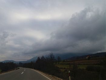 Road amidst landscape against sky