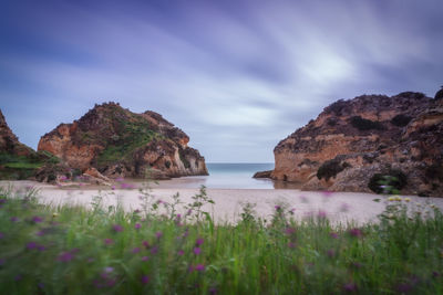 Scenic view of sea and rocks against sky