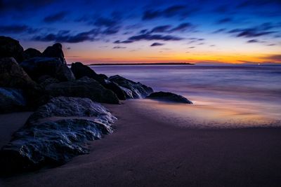 Scenic view of sea against sky at sunset