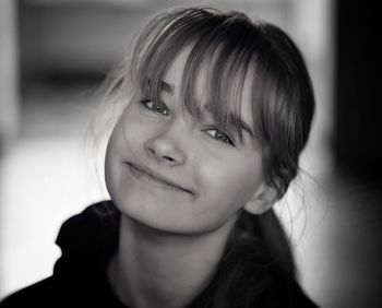 Close-up portrait of smiling teenage girl