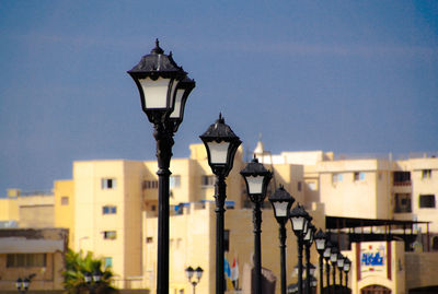 Street light against buildings in city