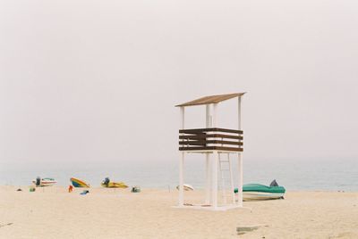 Lifeguard hut on beach against clear sky