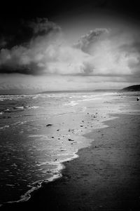 Scenic view of sea against cloudy sky