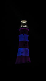 Lighthouse against black background